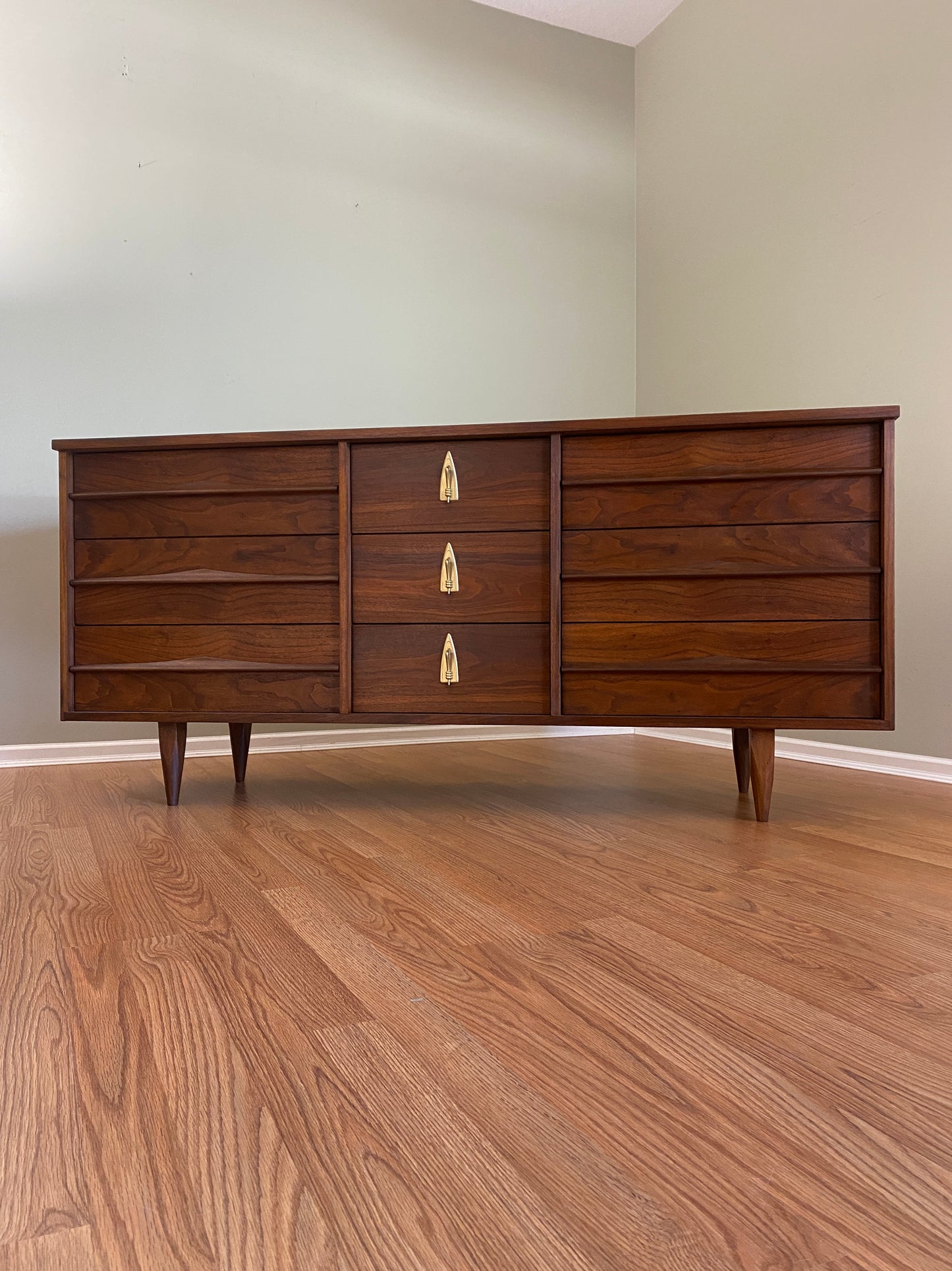 Mid Century Modern Refinished Nine Drawer Walnut Dressser with Sculpted Wooden and Gold Pulls