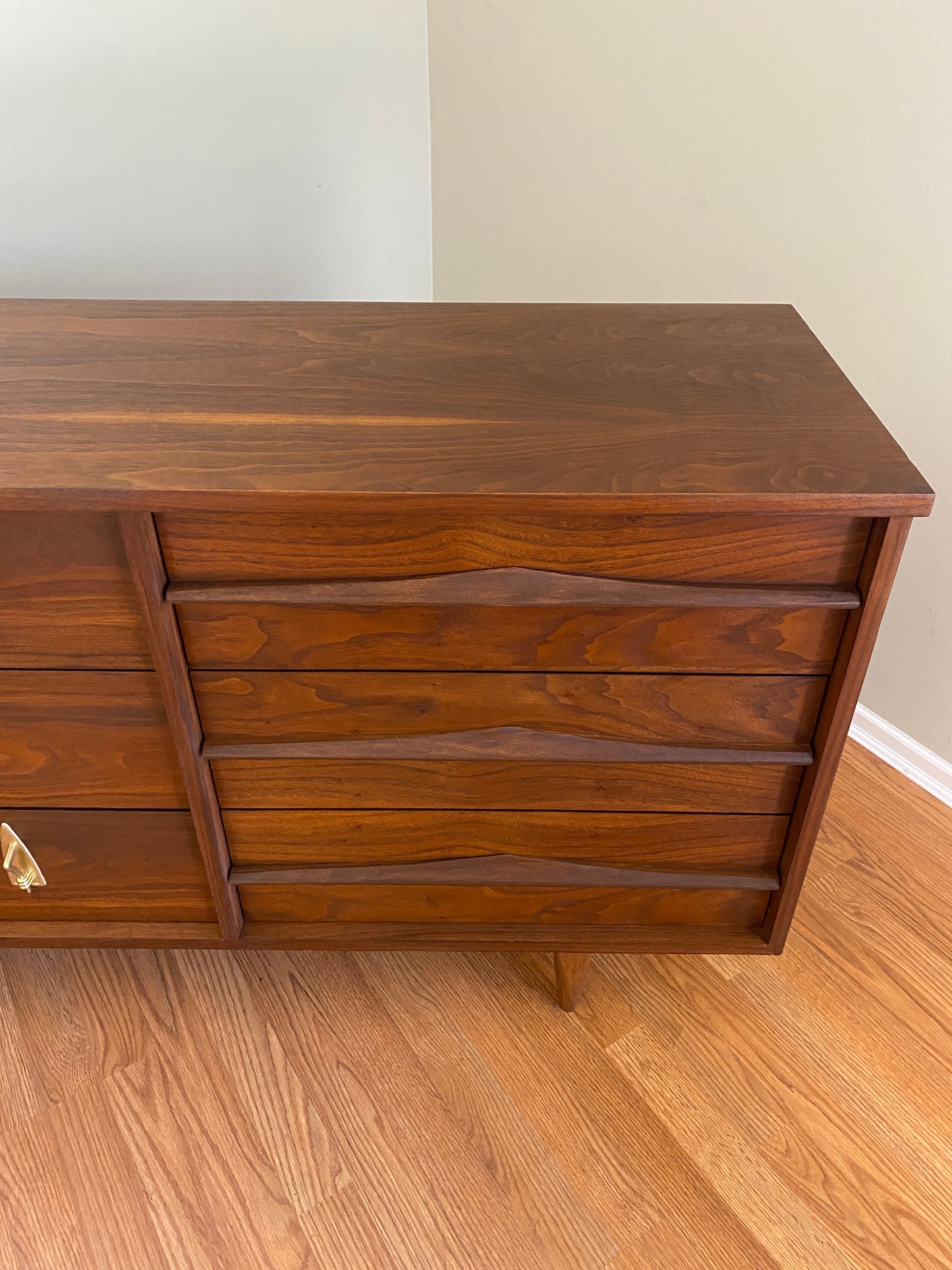 Mid Century Modern Refinished Nine Drawer Walnut Dressser with Sculpted Wooden and Gold Pulls