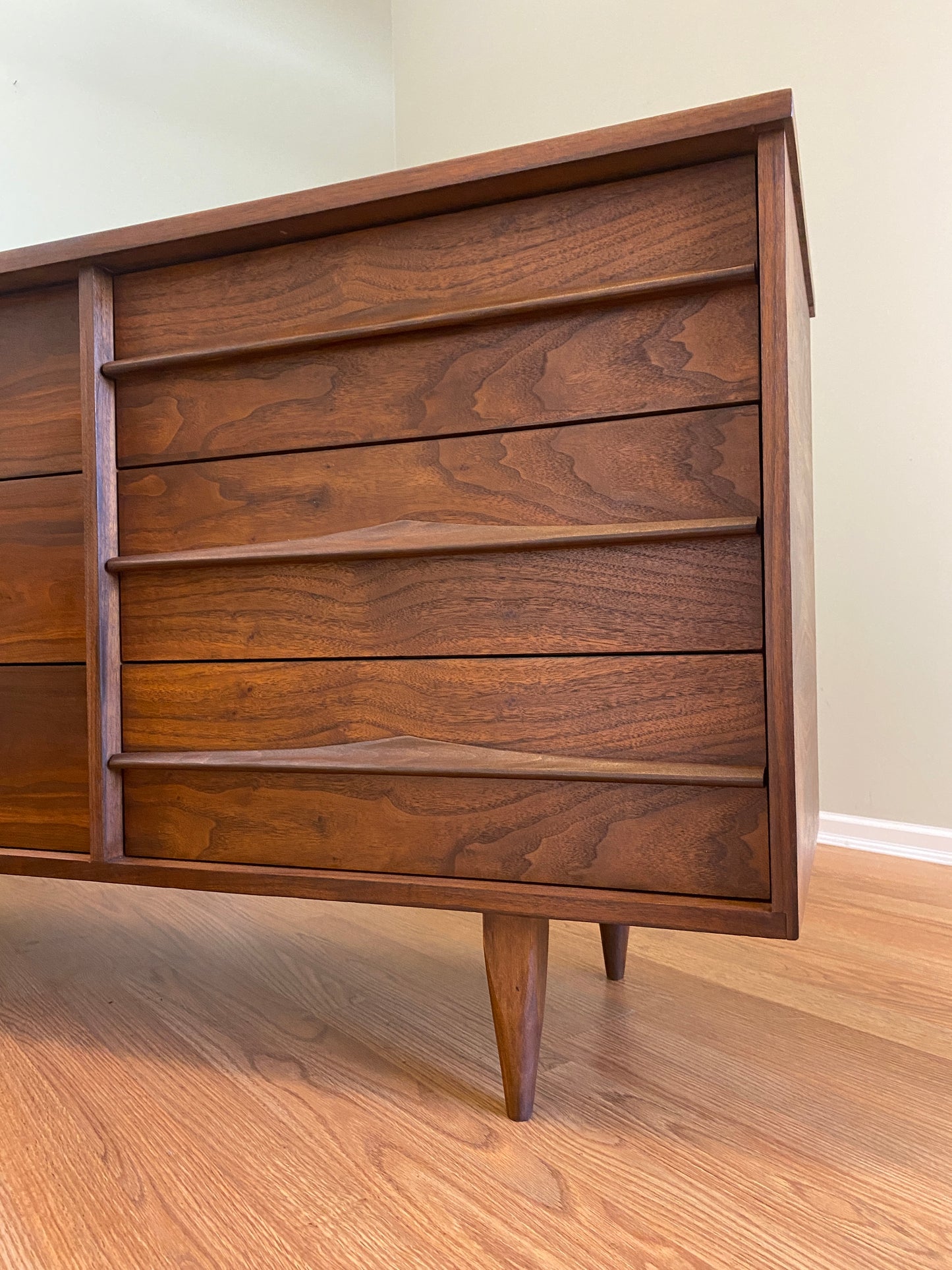 Mid Century Modern Refinished Nine Drawer Walnut Dressser with Sculpted Wooden and Gold Pulls
