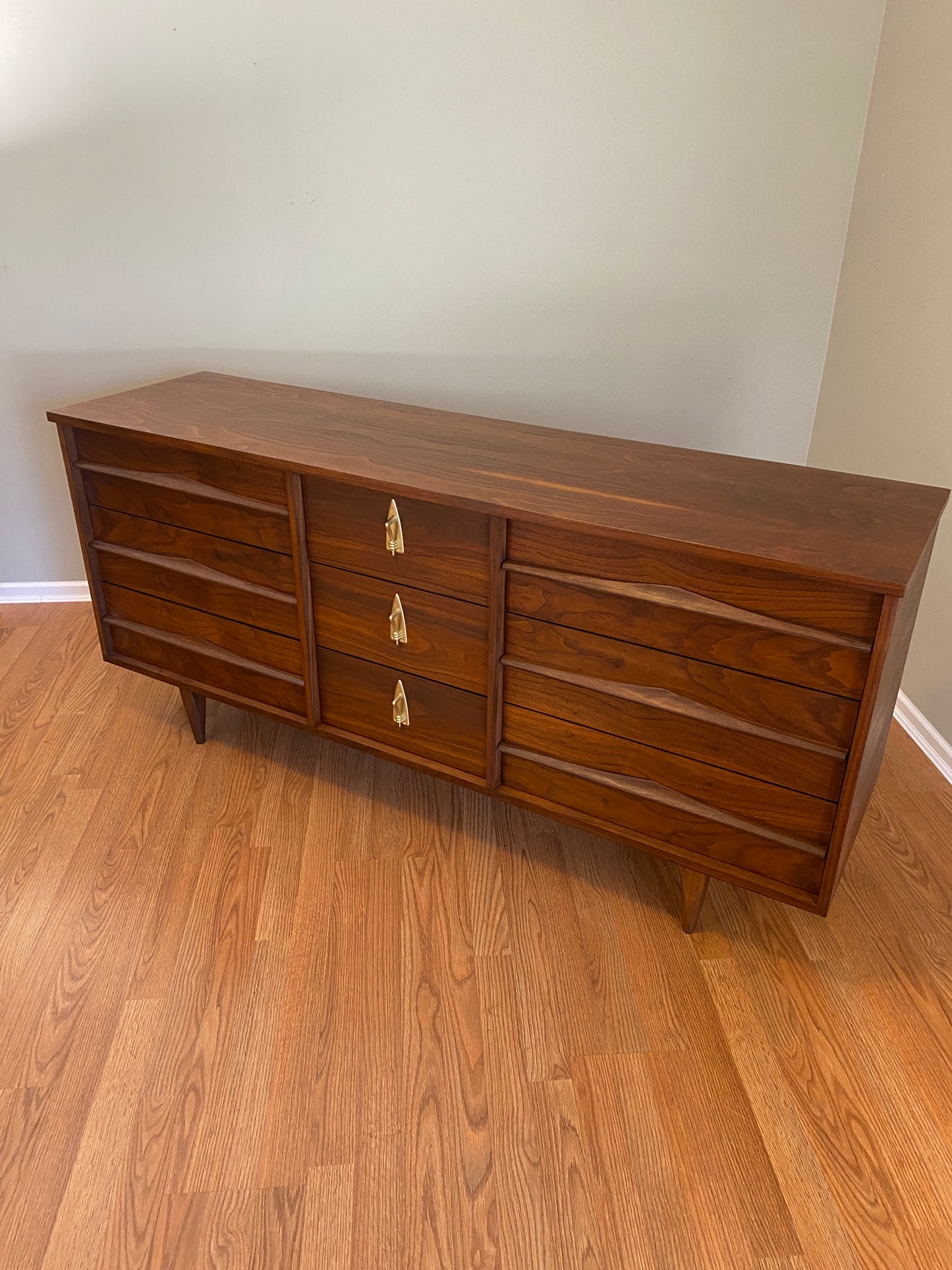 Mid Century Modern Refinished Nine Drawer Walnut Dressser with Sculpted Wooden and Gold Pulls