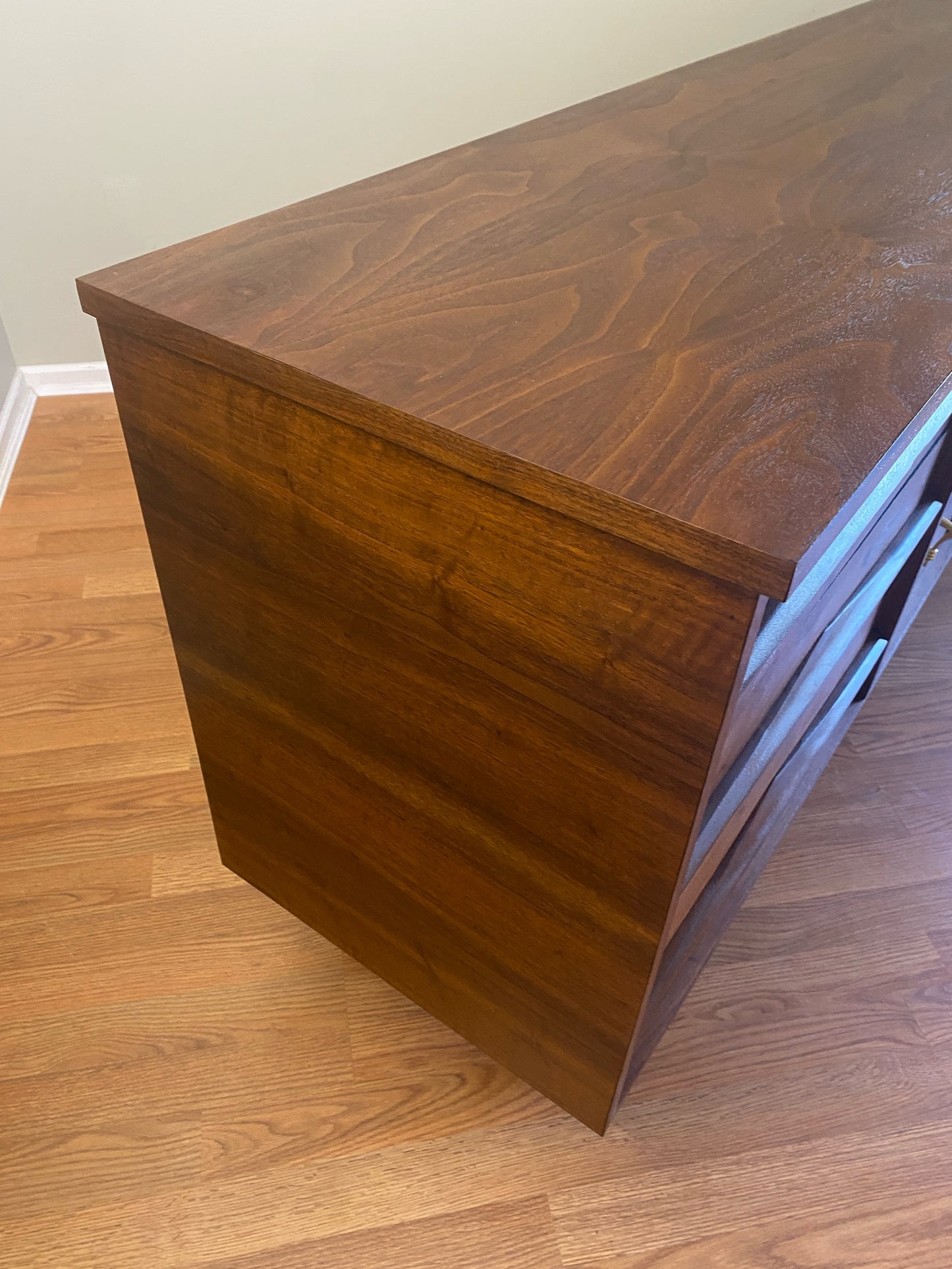 Mid Century Modern Refinished Nine Drawer Walnut Dressser with Sculpted Wooden and Gold Pulls
