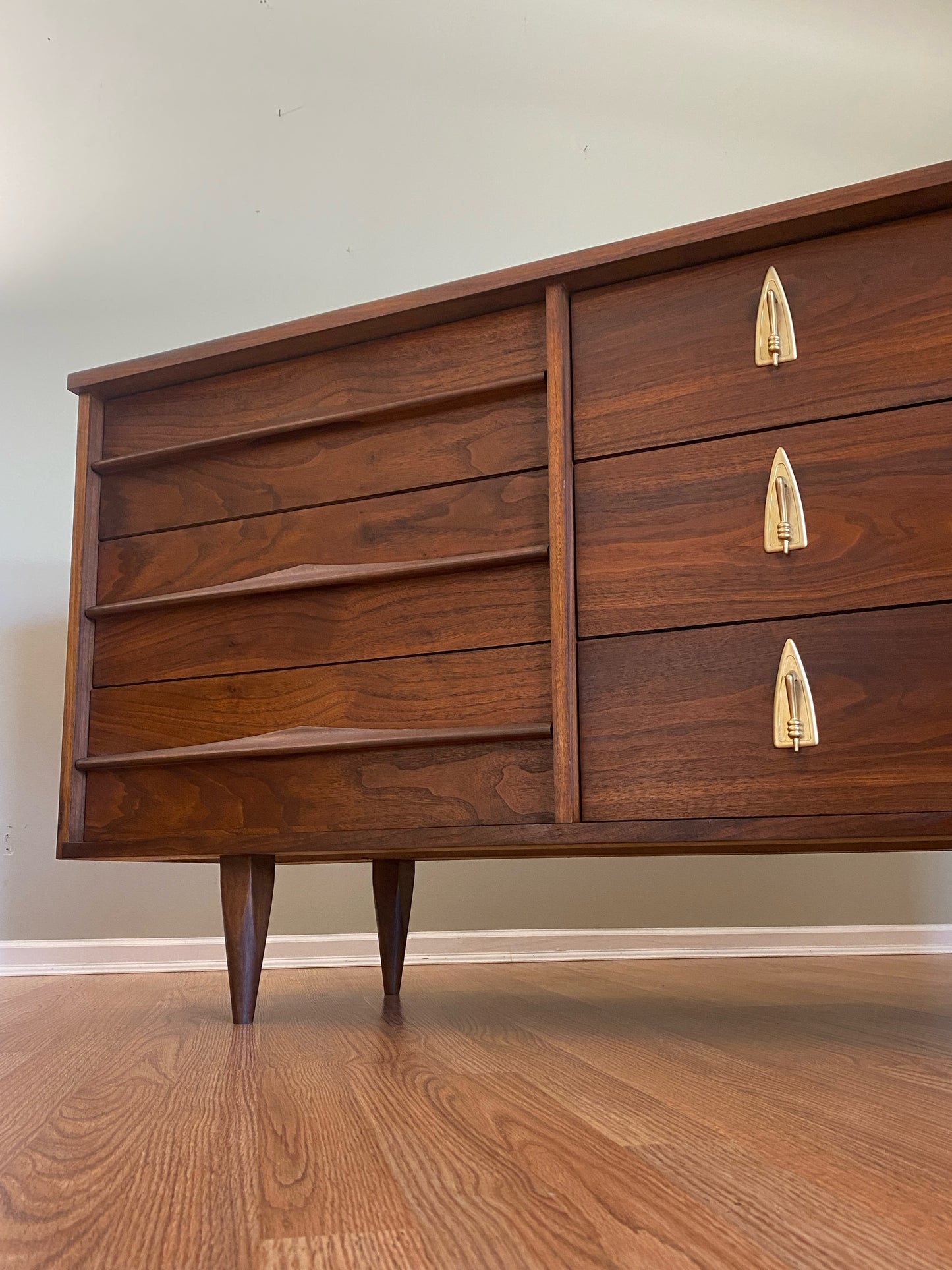 Mid Century Modern Refinished Nine Drawer Walnut Dressser with Sculpted Wooden and Gold Pulls