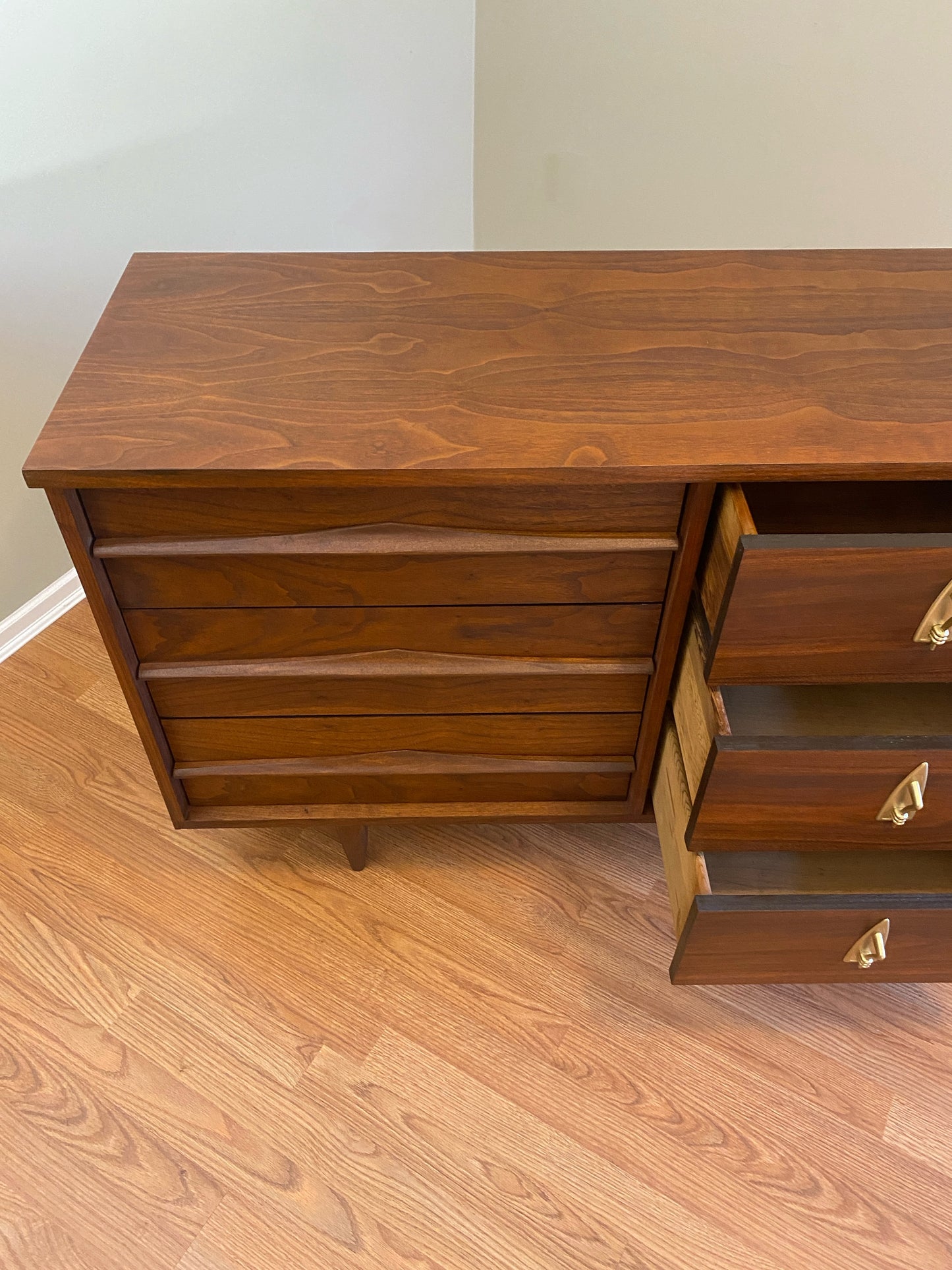 Mid Century Modern Refinished Nine Drawer Walnut Dressser with Sculpted Wooden and Gold Pulls