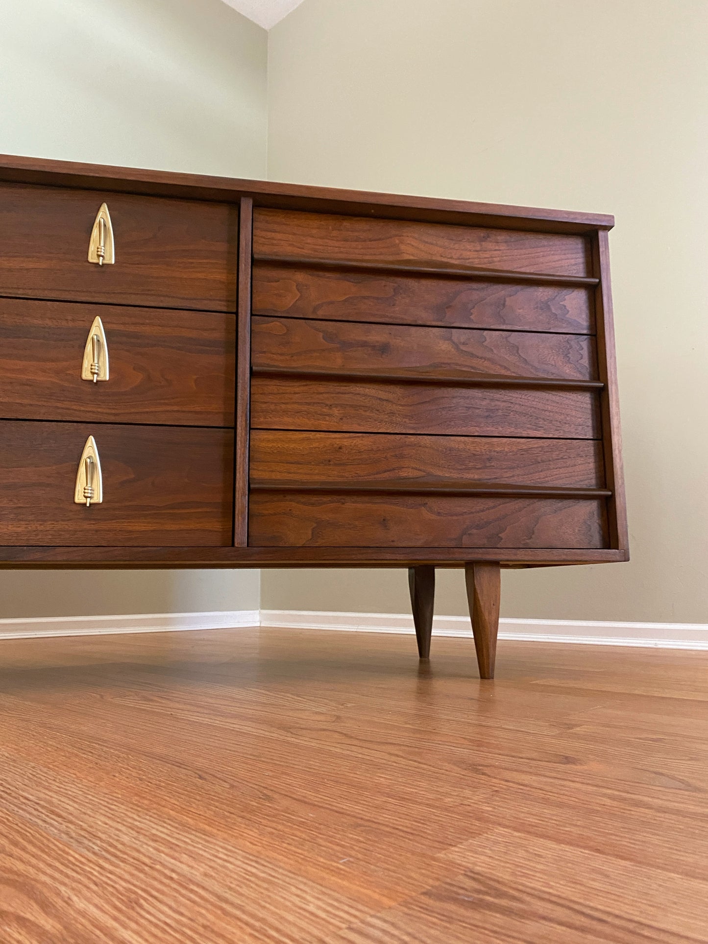 Mid Century Modern Refinished Nine Drawer Walnut Dressser with Sculpted Wooden and Gold Pulls